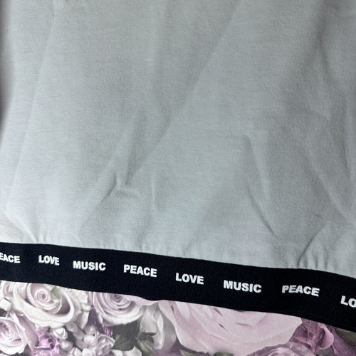 White short-sleeve crop top with black elastic band, size M