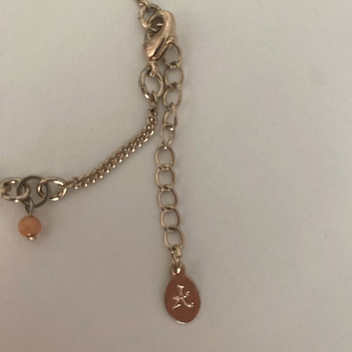 Accessorize bracelet with charms in pink and gold, like new
