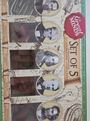 Great Minds Puzzle Set of 5 like new, 3 wooden and 2 metal puzzles