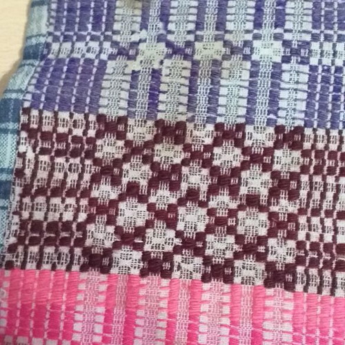 Old warp-weighted loom pillow used, very old with wear