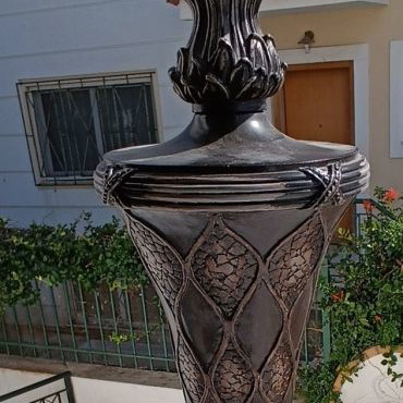 Table lamp with silk shade and carved base