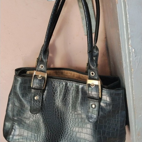 Vintage black women's shoulder bag with crocodile and snake texture, used