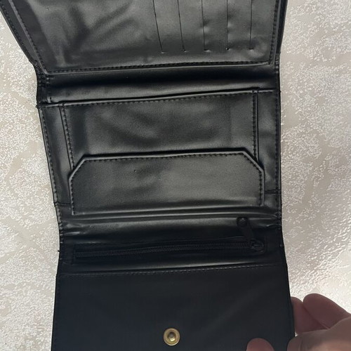 Women's black wallet like new with textured surface