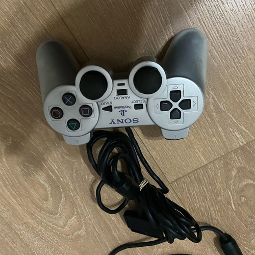 PlayStation 2 silver controller used with faulty buttons