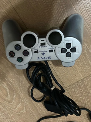 PlayStation 2 silver controller used with faulty buttons