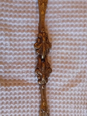 Vintage solid brass nutcracker with baroque relief carving, like new
