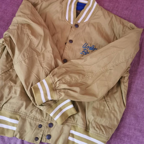 Unlimited spring jacket size M like new, gold color