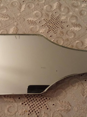 Mirror with pebble decoration