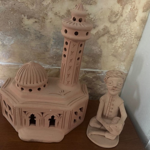 African clay decorative set with figure and palace