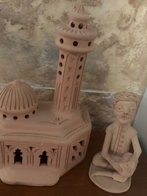 African clay decorative set with figure and palace