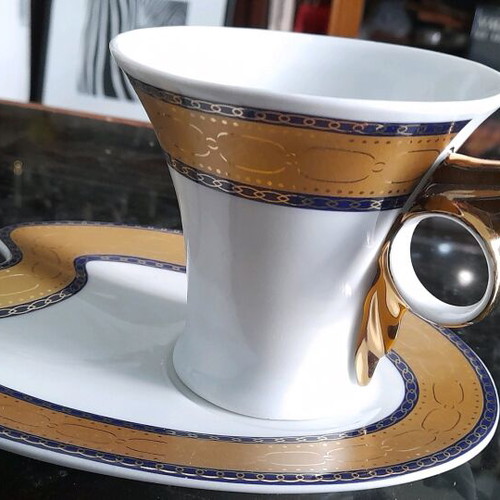 Limoge coffee cup set used, 2 cups with Hermes feather design