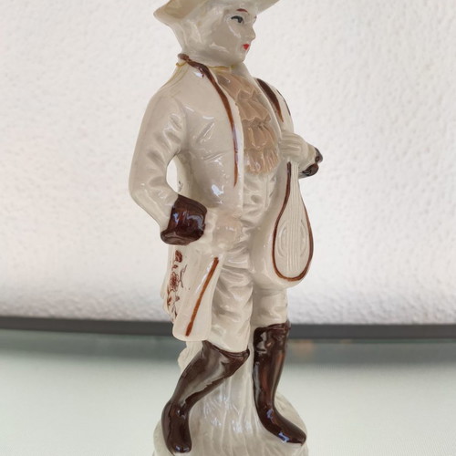 Porcelain decorative figure of man used with musical instrument