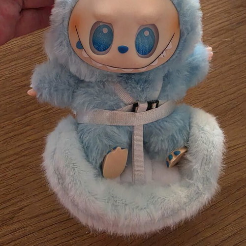Labubu doll with car seat attachment