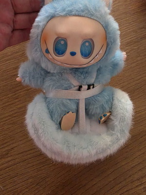 Labubu doll with car seat attachment