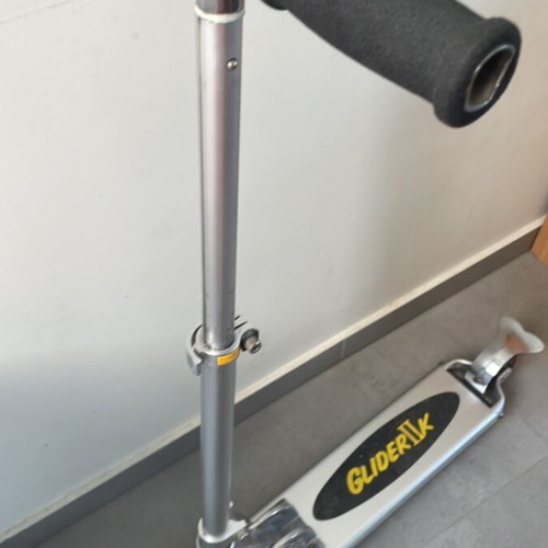 Scooter used with adjustable handlebar height and rear wheel brake