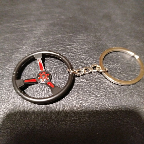 Metal car keychain new with sporting black red steering wheel design