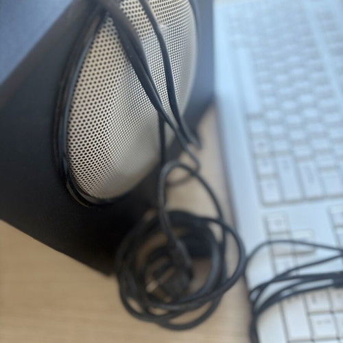 Fujitsu-Siemens computer monitor and Logitech speakers with keyboard and webcam