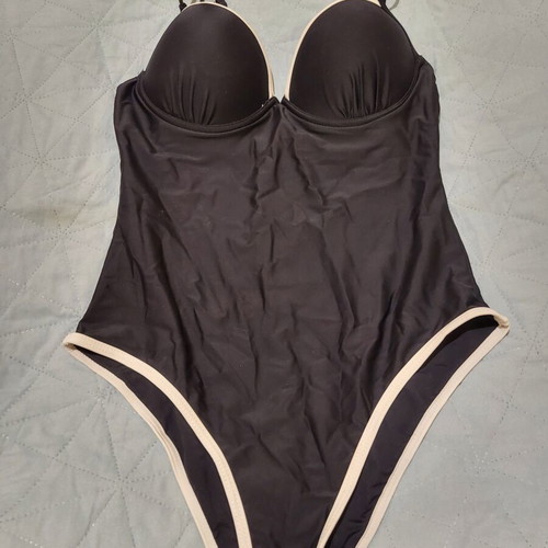 One-piece swimsuit like new, black with white details and rings, size M