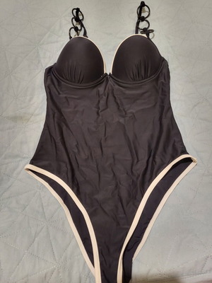 One-piece swimsuit like new, black with white details and rings, size M