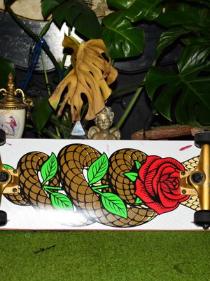 Goodbie skateboard used with gold trucks and black Amila wheels