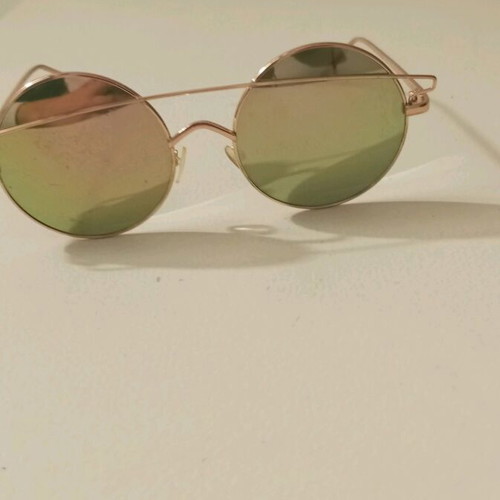 Sunglasses like new with rose gold frame and color-changing lenses