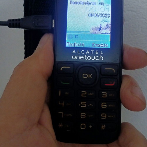 Alcatel OneTouch classic mobile phone used with keypad