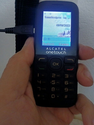 Alcatel OneTouch classic mobile phone used with keypad