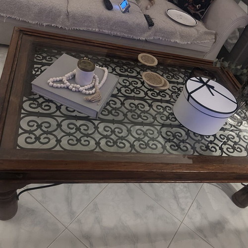 Large wooden coffee table with glass and metal decoration