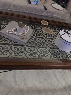 Large wooden coffee table with glass and metal decoration