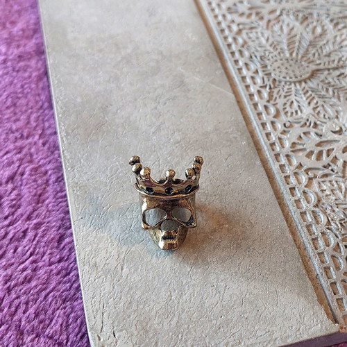 Bronze skull ring with crown, rock style