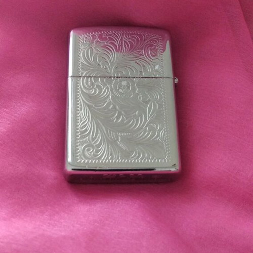 Zippo lighter collectible like new, silver with engravings