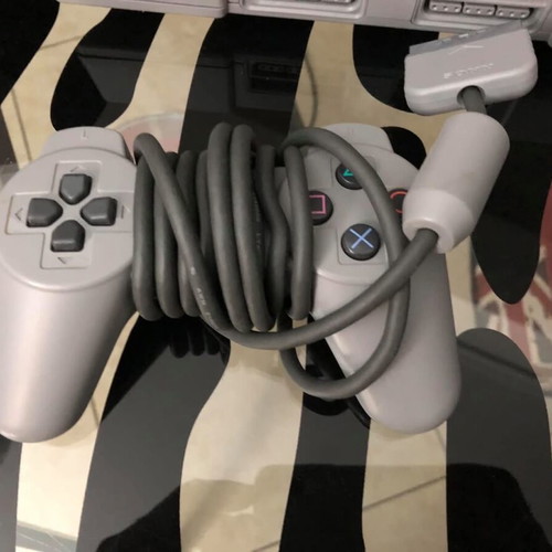 Sony PlayStation console used with official bag, controller and cables