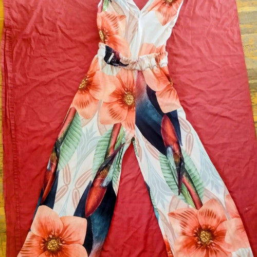 One-piece jumpsuit used, sleeveless with elastic waist, size Large