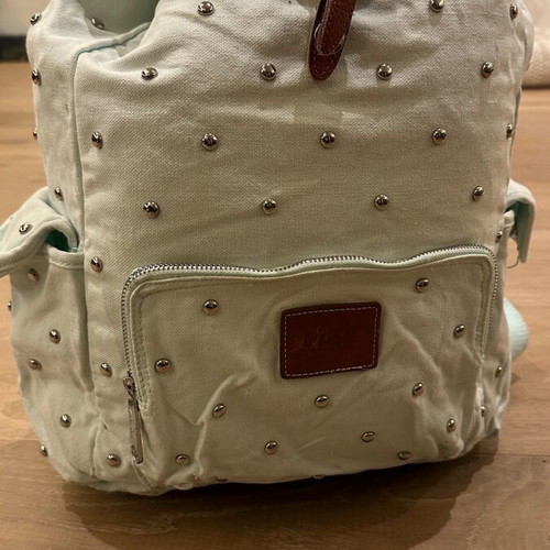 Pink backpack used, fabric turquoise with studs