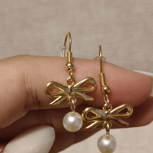 Handmade stainless steel earrings with bow and pearls