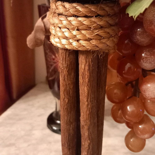 Handmade candlesticks used, set made of branches, rope and metal