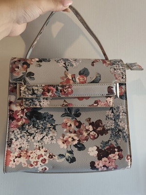 Blue floral handbag with matching strap