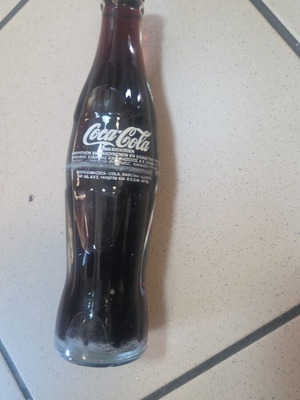 Coca-Cola glass soda bottle sealed from 1980 period