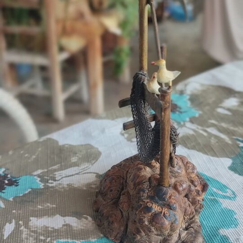 Vintage sea-themed decoration handmade from metal and cork used