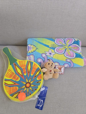 Beach bundle with towel, rackets, and bath toy like new