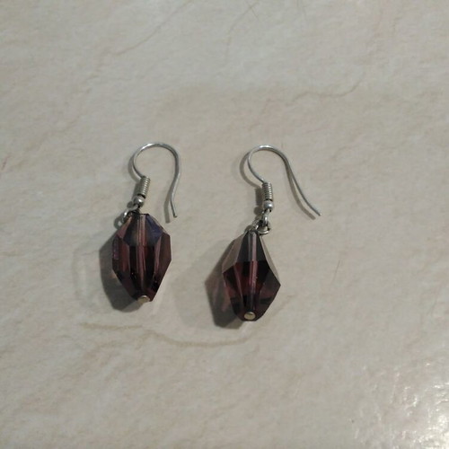 Earrings pair with sparkling purple diamonds like new