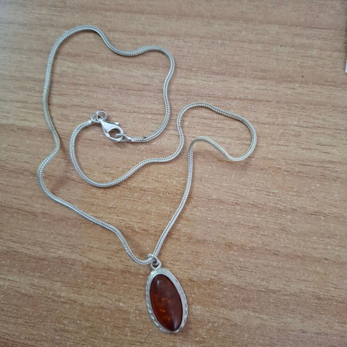 Women's oval pendant with amber and silver chain like new