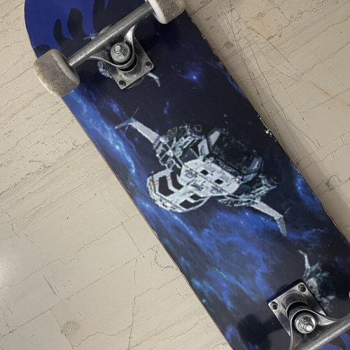 Skateboard used with satellite design on bottom