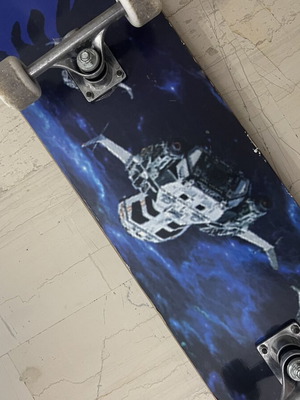 Skateboard used with satellite design on bottom