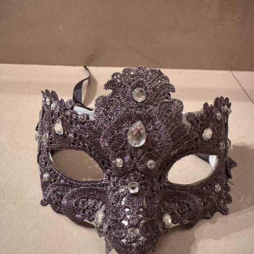 Two ornate masks like new, one gray and one white