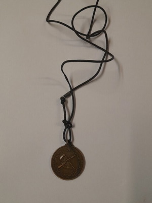 Medal used with national emblem of Mozambique