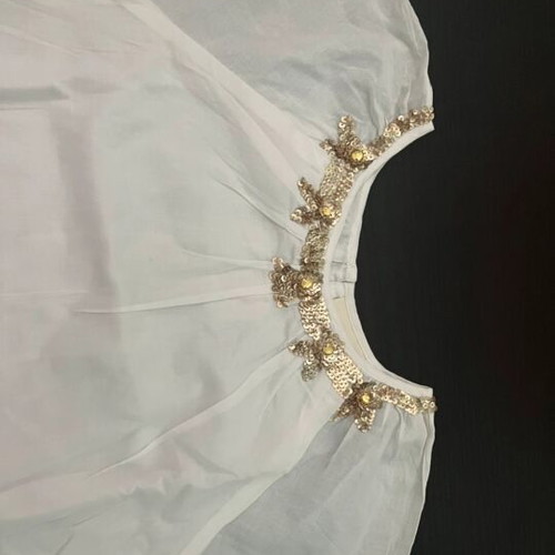 White blouse with gold details