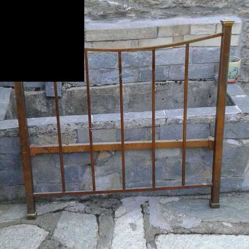 Iron bed used, early 20th century with brass details