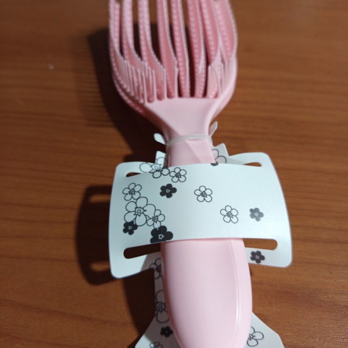 Pink detangling hair comb