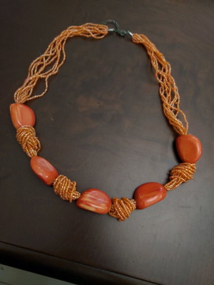 Necklace with orange stones and beads like new